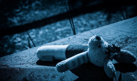 Symbolic, mournful photo of child's teddy bear