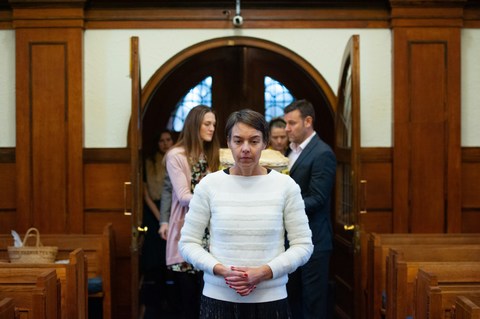 Family at funeral inside church